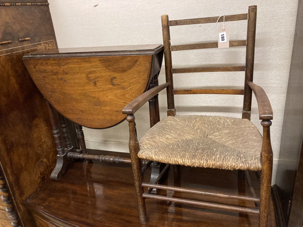 A late Victorian walnut Sutherland table, width 53cm height 56cm, together with a childs rush seat elbow chair